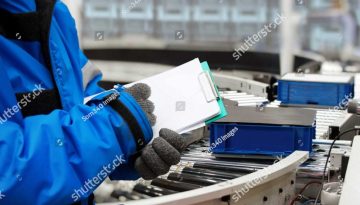 stock-photo-closeup-shooting-hand-of-worker-with-clipboard-checking-plastic-crate-for-fruits-and-vegetables-1444636181